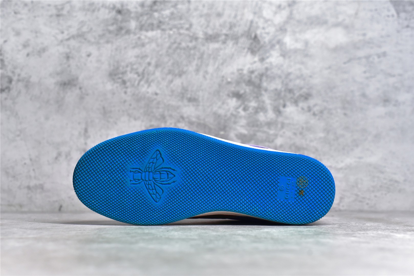 Gucci Screener series distressed sneakers, grey, blue, and orange colorway.