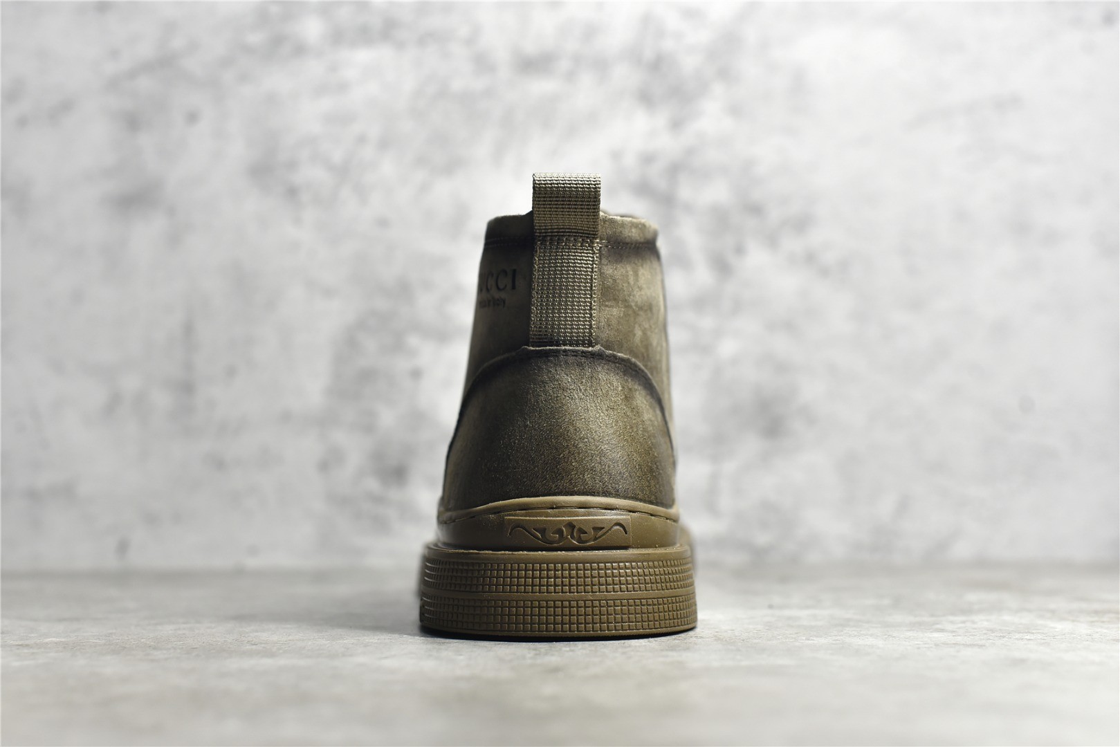 Gucci mid-top work boots/Doc Martens with a vintage distressed finish.