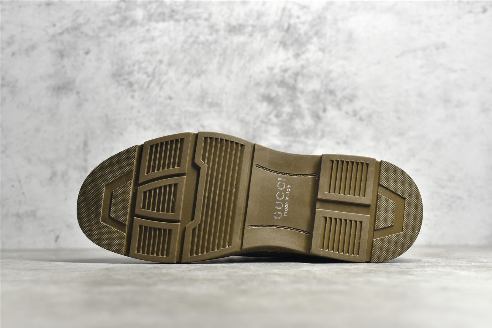 Gucci mid-top work boots/Doc Martens with a vintage distressed finish.