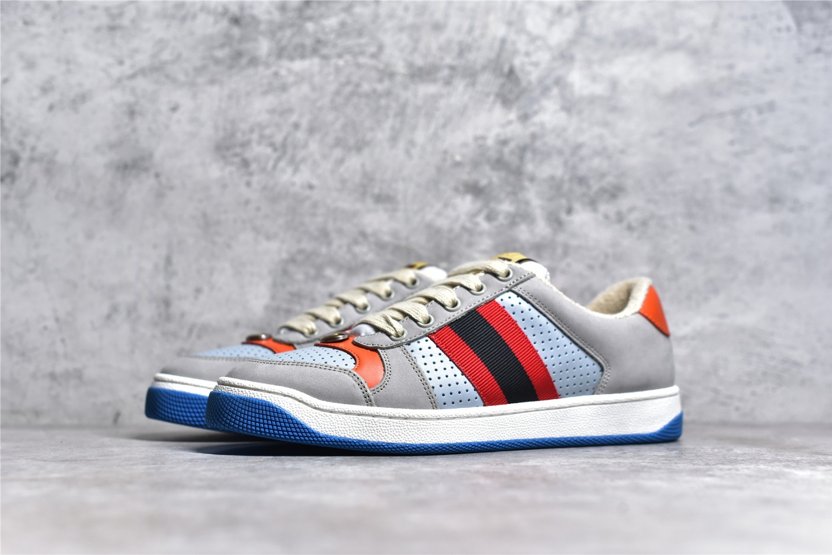 Gucci Screener series distressed sneakers, grey, blue, and orange colorway.