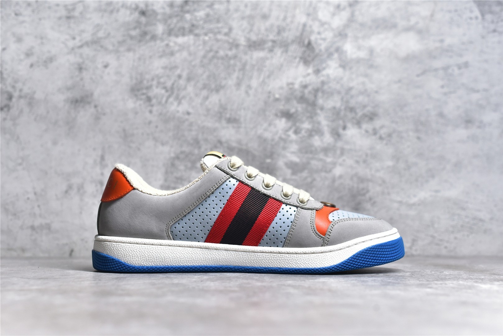 Gucci Screener series distressed sneakers, grey, blue, and orange colorway.
