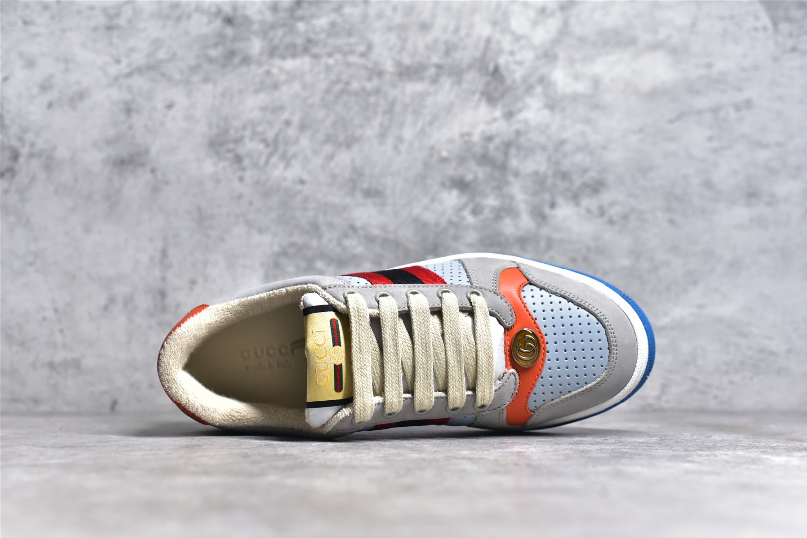 Gucci Screener series distressed sneakers, grey, blue, and orange colorway.